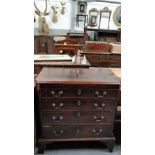 An 18th century mahogany chest of drawers, with a pull out writing desk, four long drawers, on