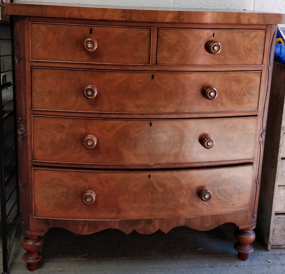 A Victorian bow front chest of drawers, with mother inlaid handles, of two short and three long,