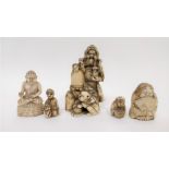 A 19th century ivory netsuke of a standing figure holding pagoda with two other figures, along