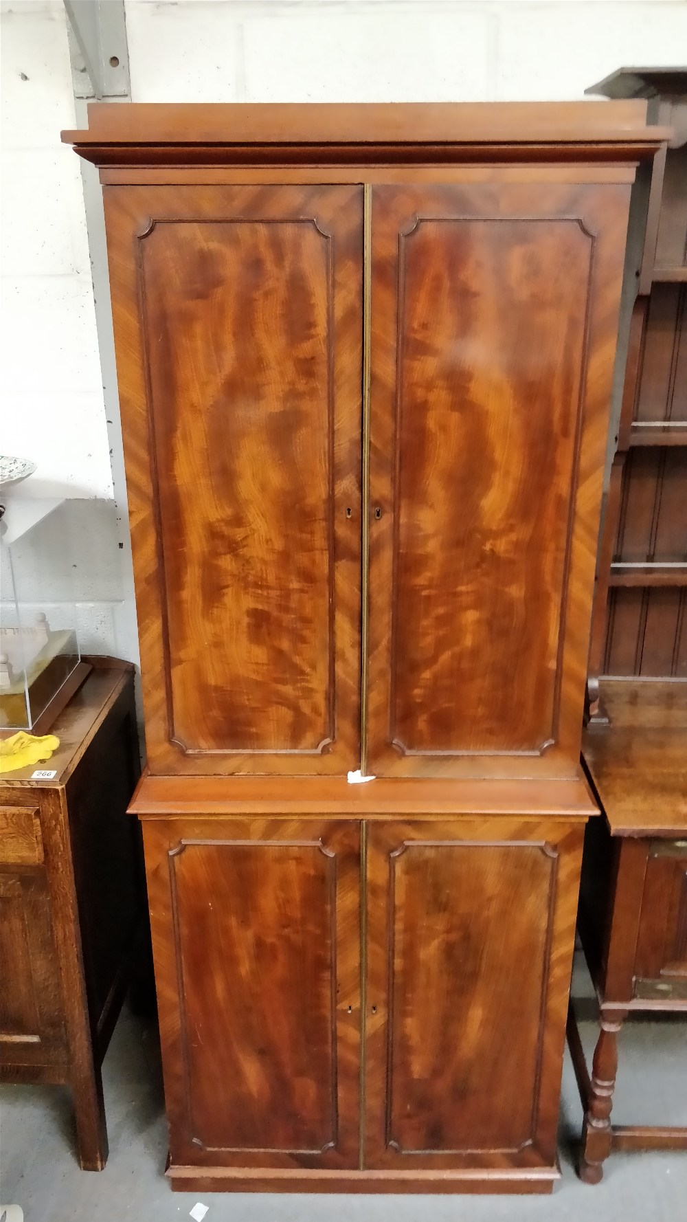 A Victorian mahogany linen press, with fitted cupboard section and five fitted drawers and brass