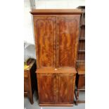 A Victorian mahogany linen press, with fitted cupboard section and five fitted drawers and brass