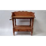 An early 20th century pine washstand, with single fitted drawer and side rail, 89cm high, 83cm long,