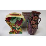 A Clarice Cliff style vase, along with a Torquay pottery vase decorate with flowers