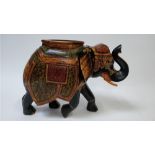 A 20th century painted hardwood model of an Indian elephant, 47cm high, 60cm long