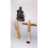 A ivory shoehorn, along with a hard stone figure of a seated gentleman and figure of Christ on the