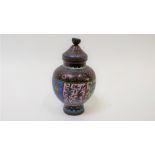 A Chinese cloisonné baluster shaped jar and cover, decorated with various flowers and plants, 12cm