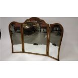 A 19th century three section dressing table mirror, of shaped form and in a gilt surround, 82cm