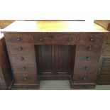 A Victorian mahogany kneehole desk, set with a single fitted two door cupboard section, eleven