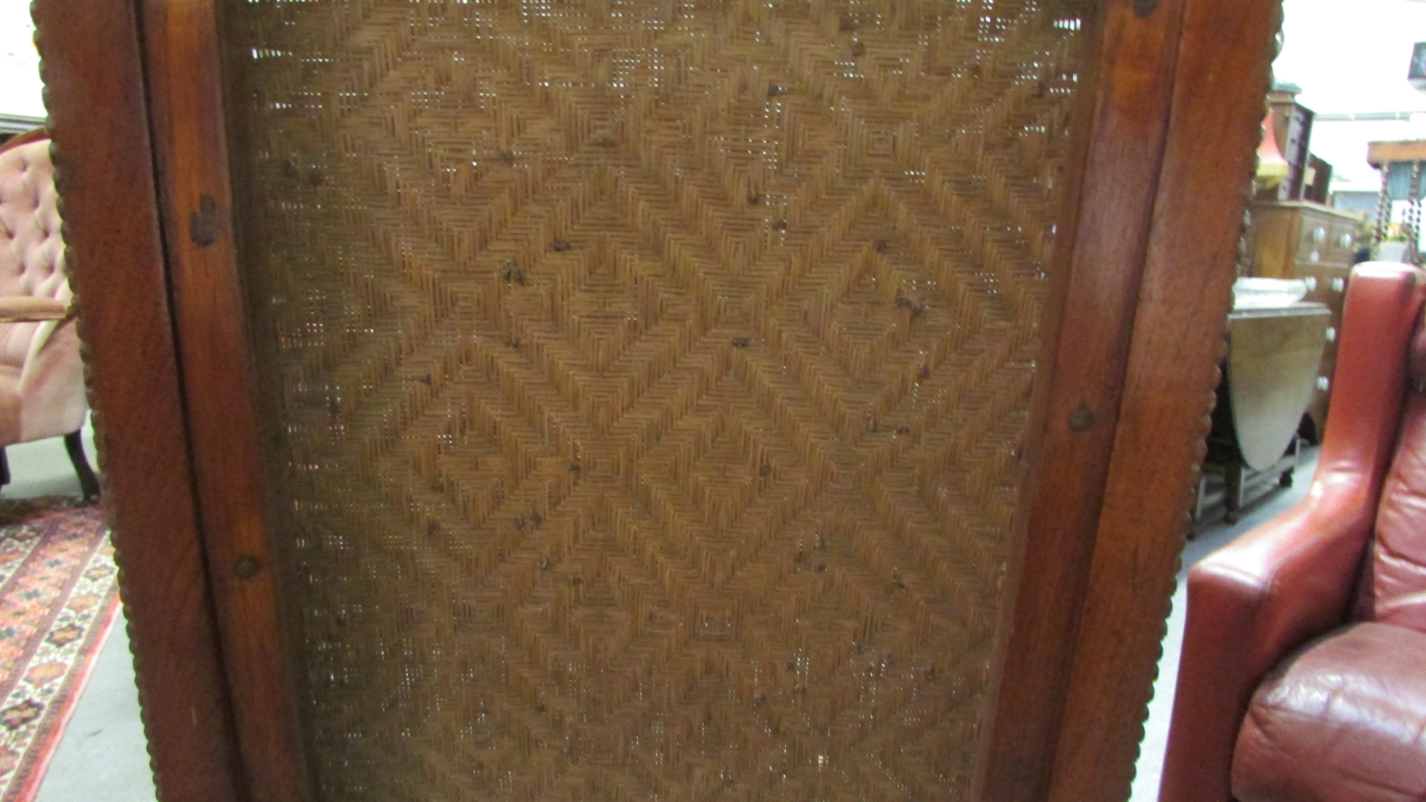A 19th century Anglo Indian carved hardwood chair with a wicker seat and back - Image 6 of 7