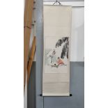 A 20th century Chinese hanging scroll, painted with a scene of boy doing calligraphy