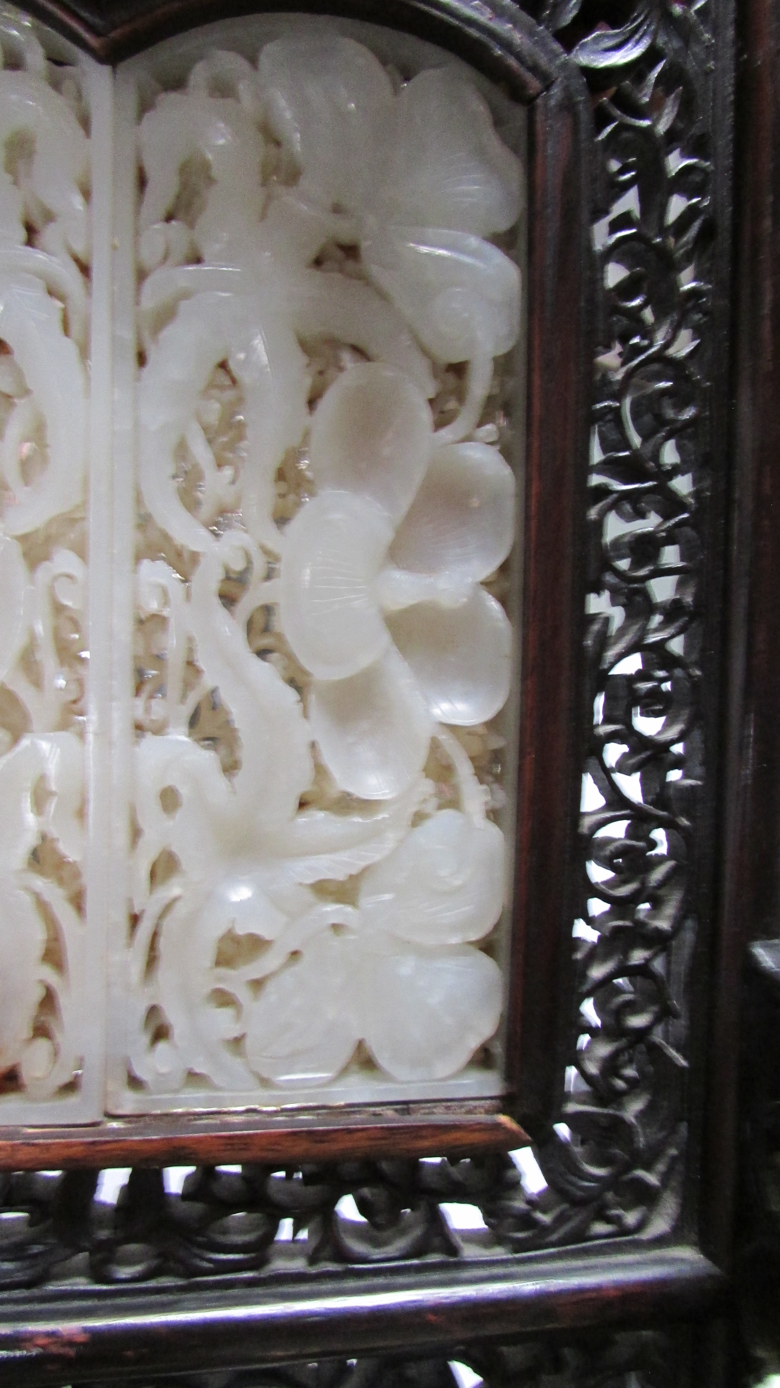 A 20th century Chinese table screen, the white jade panel decorated with flowers in a hardwood frame - Image 7 of 7