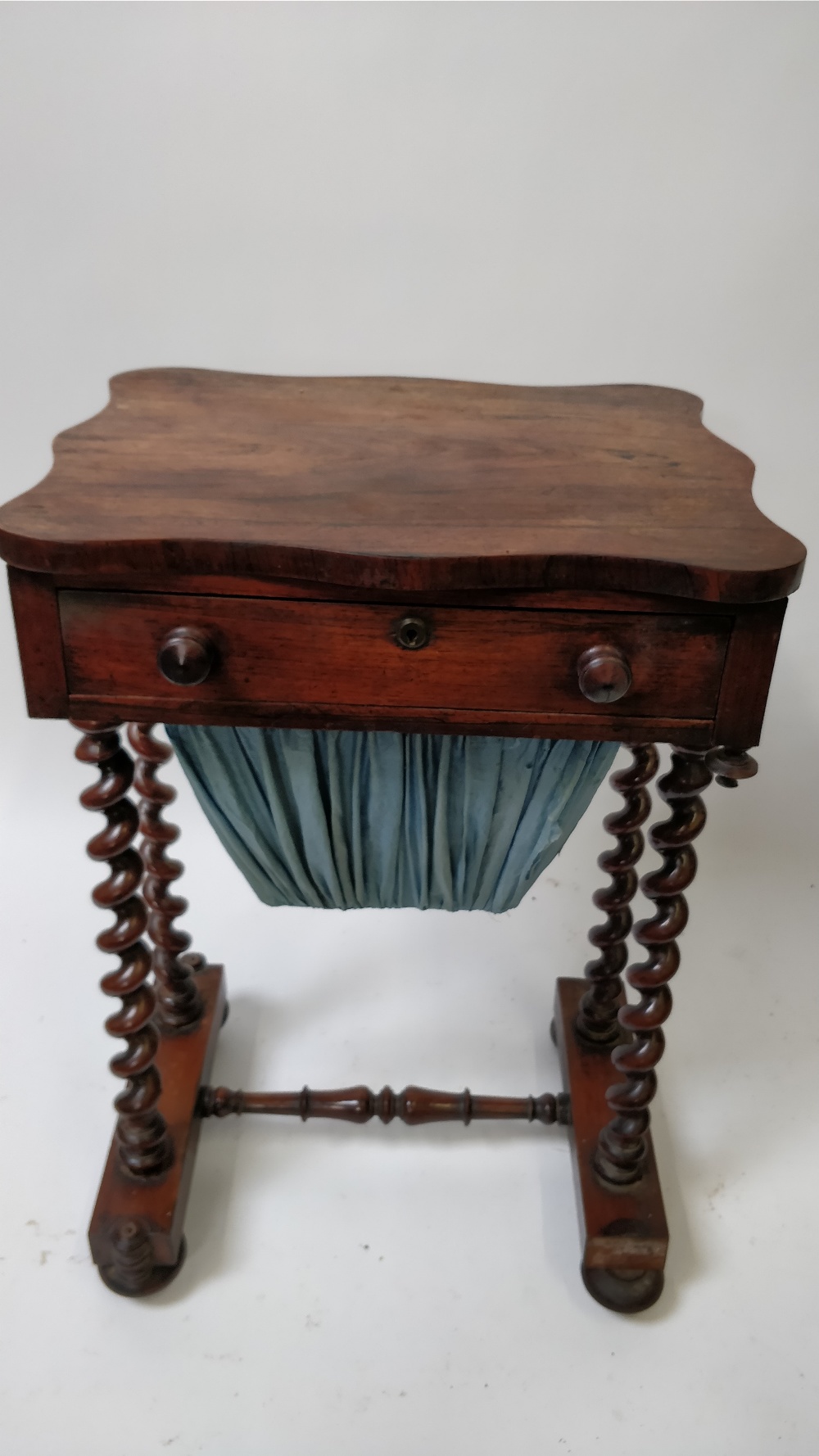 A Victorian rosewood sewing table, with single fitted drawer, barley twist leg, 78cm high, 53cm