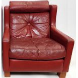 A 1970's red leather armchair by Minty & Co