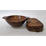 A late 19th century wooden bowl, along with wooden chopping board