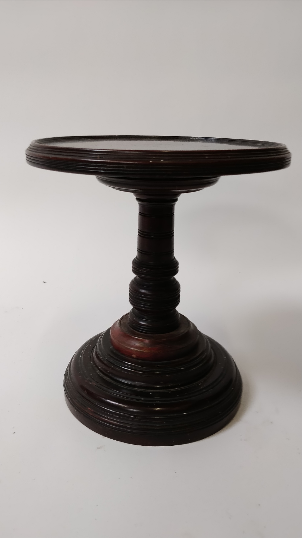 A Victorian mahogany adjustable table stand, with a turned stem and base, 32cm high