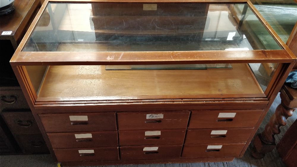 A mid 20th century haberdashery set with nine fitted drawers, 92cm high, 122cm long, 59cm wide