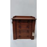 An early 20th century mahogany four section Wellington chest, with open out lockable flap, 40cm