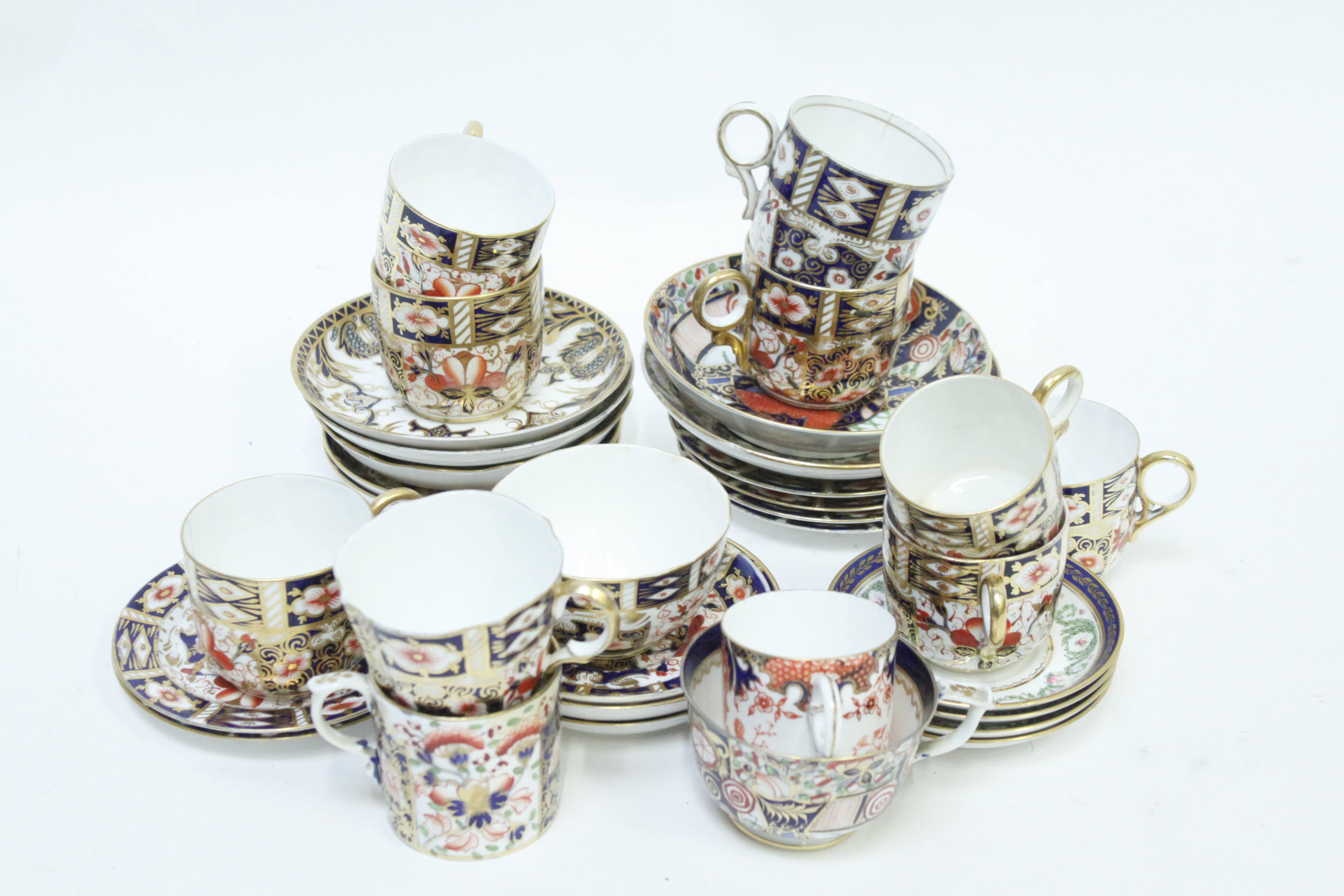 A collection of Royal Crown Derby tea and coffee cups and saucers