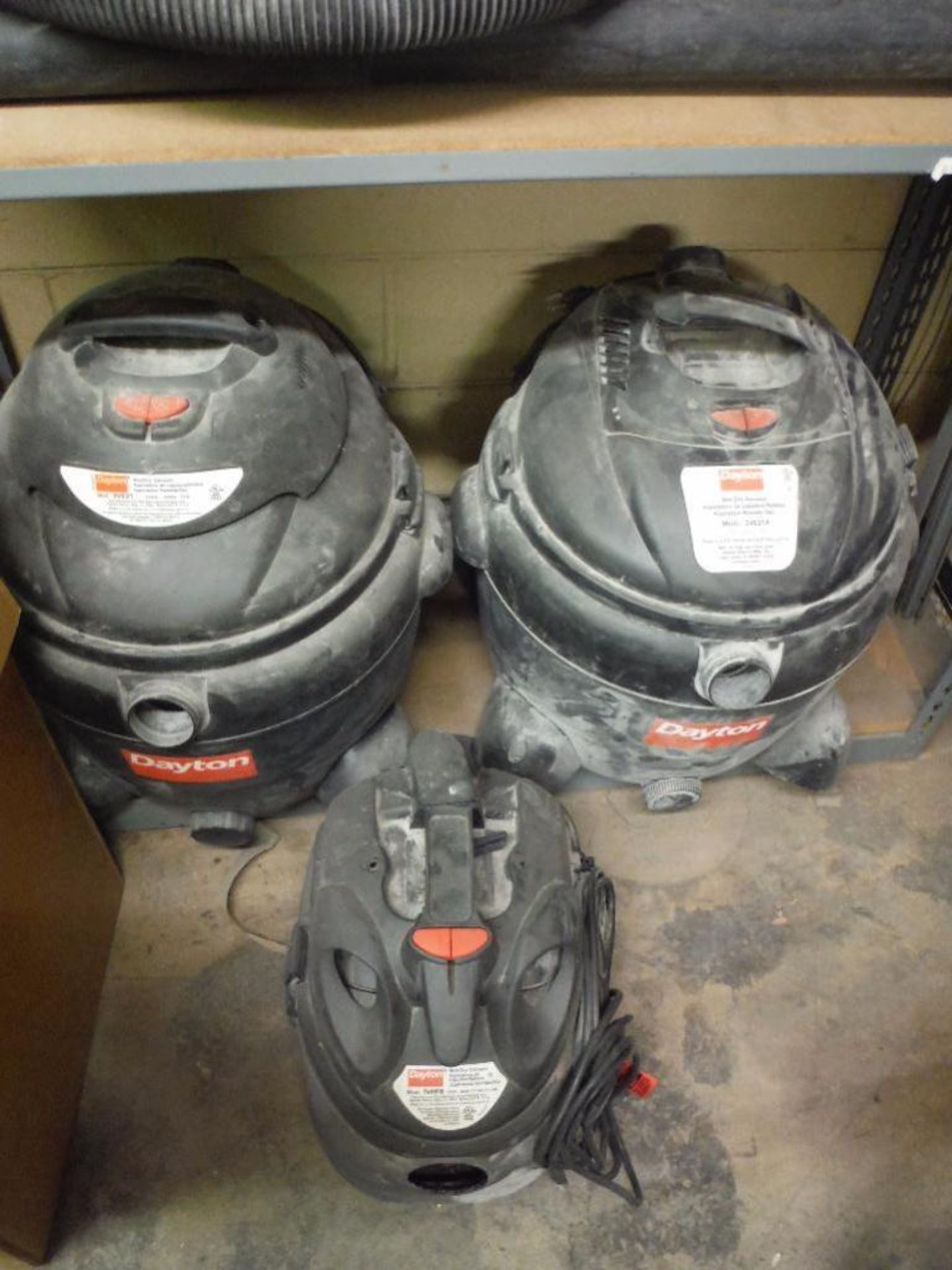 Contents of 1 sections of shelving, new in box Dayton shop vac, multiple used shop vacs ** Rigging - Image 4 of 12