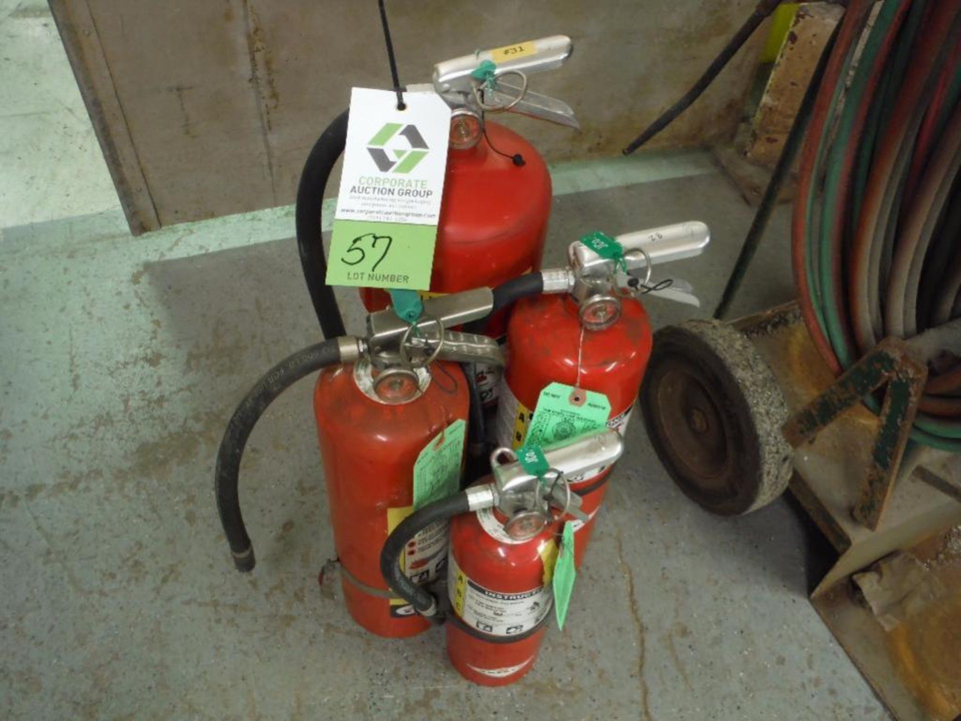 4 assorted size abc fire extinguishers ** Rigging Fee: $10 **