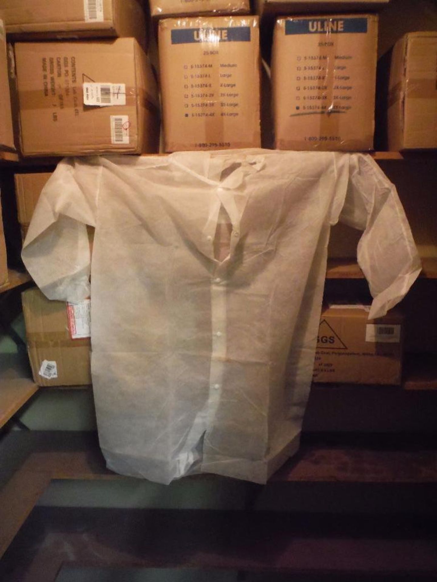 Contents of shelves, (15) cases of assorted lab coats ** Rigging Fee: $50 ** - Image 9 of 9