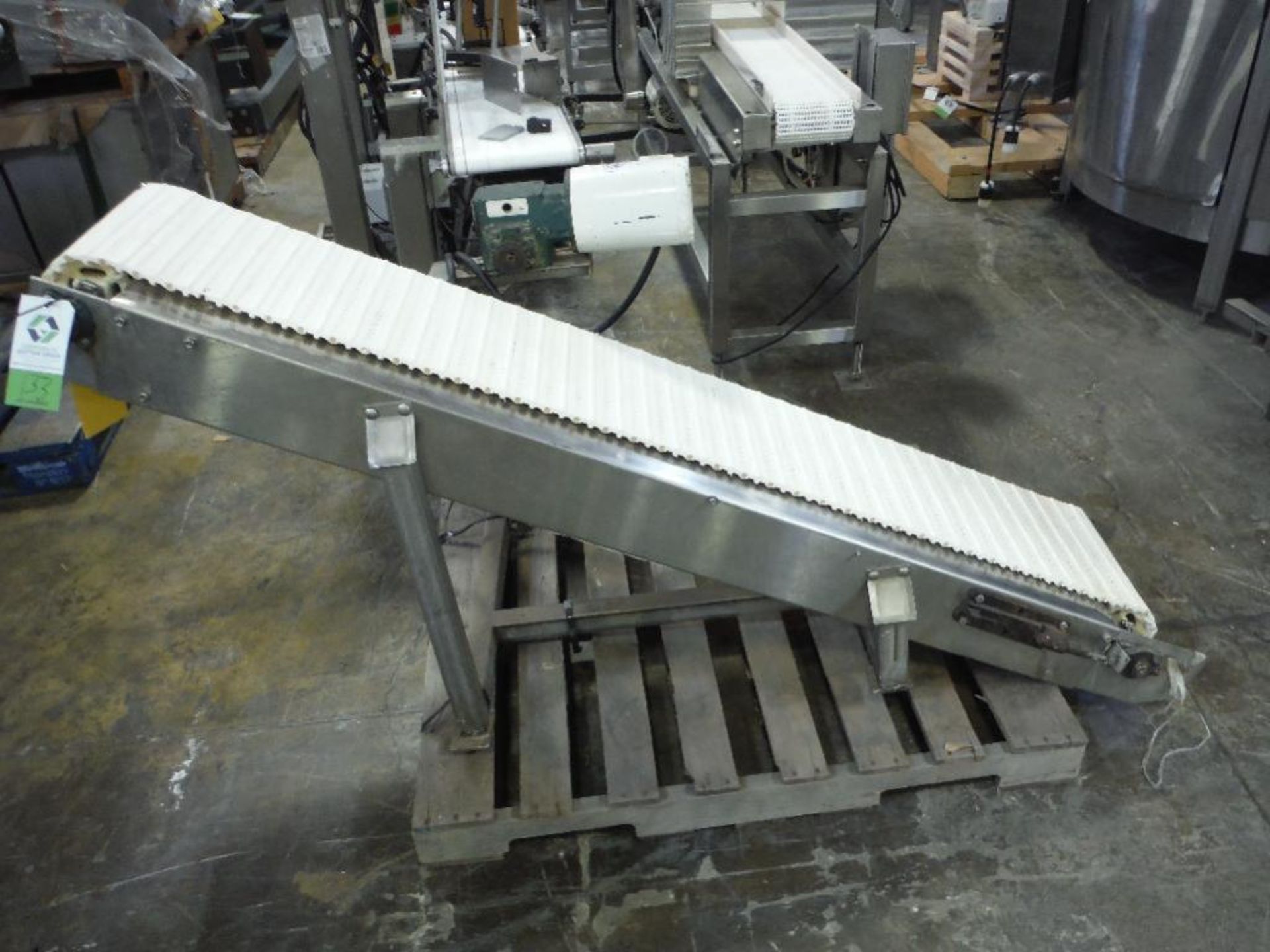 SS incline conveyor, 80 in. long x 14 in. wide x 10 in. infeed x 48 in. discharge, missing motor and