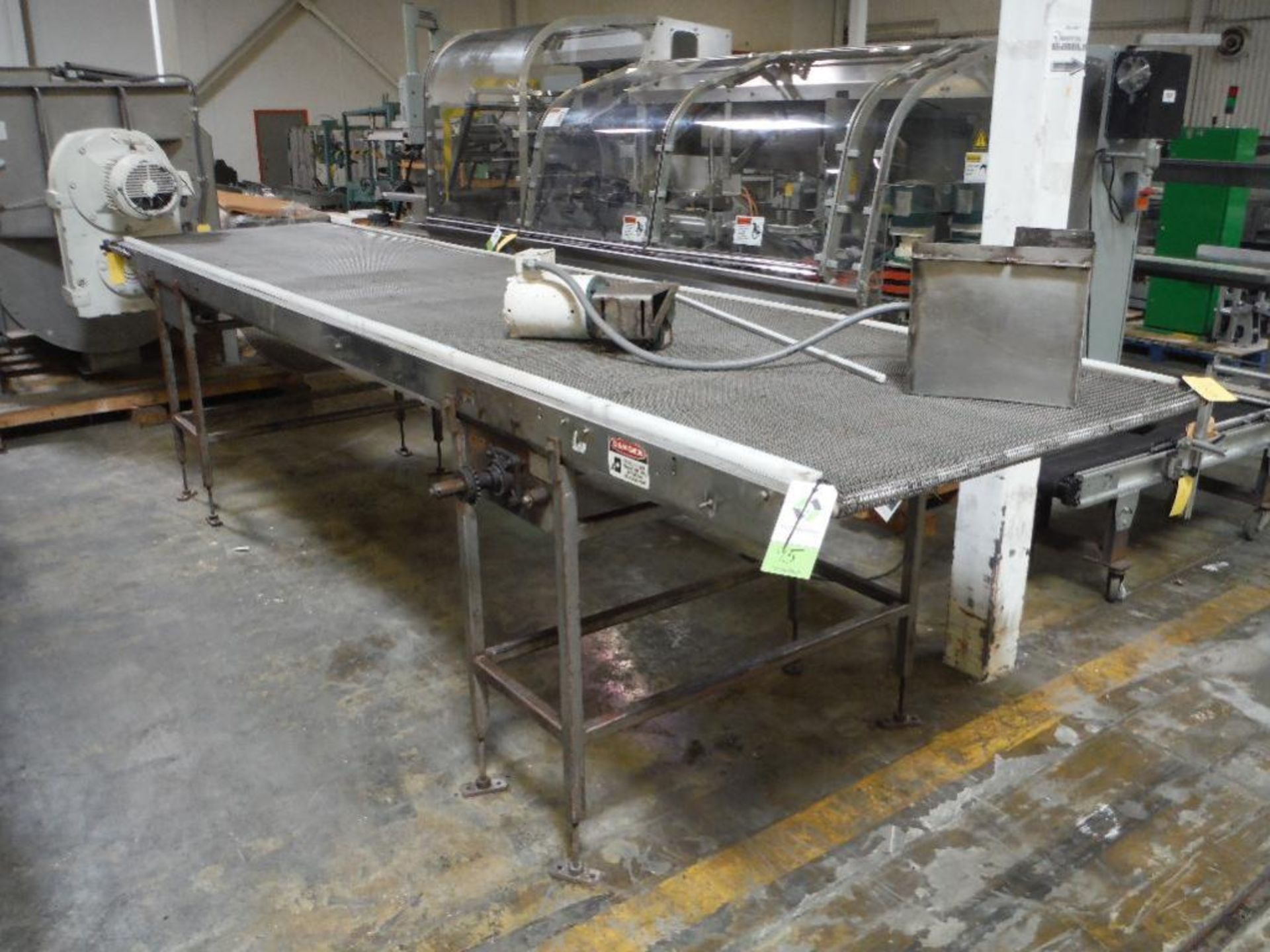 Mesh belt conveyor, 200 in. long x 43 in. wide x 46 in. tall, SS frame, carbon steel legs, motor and
