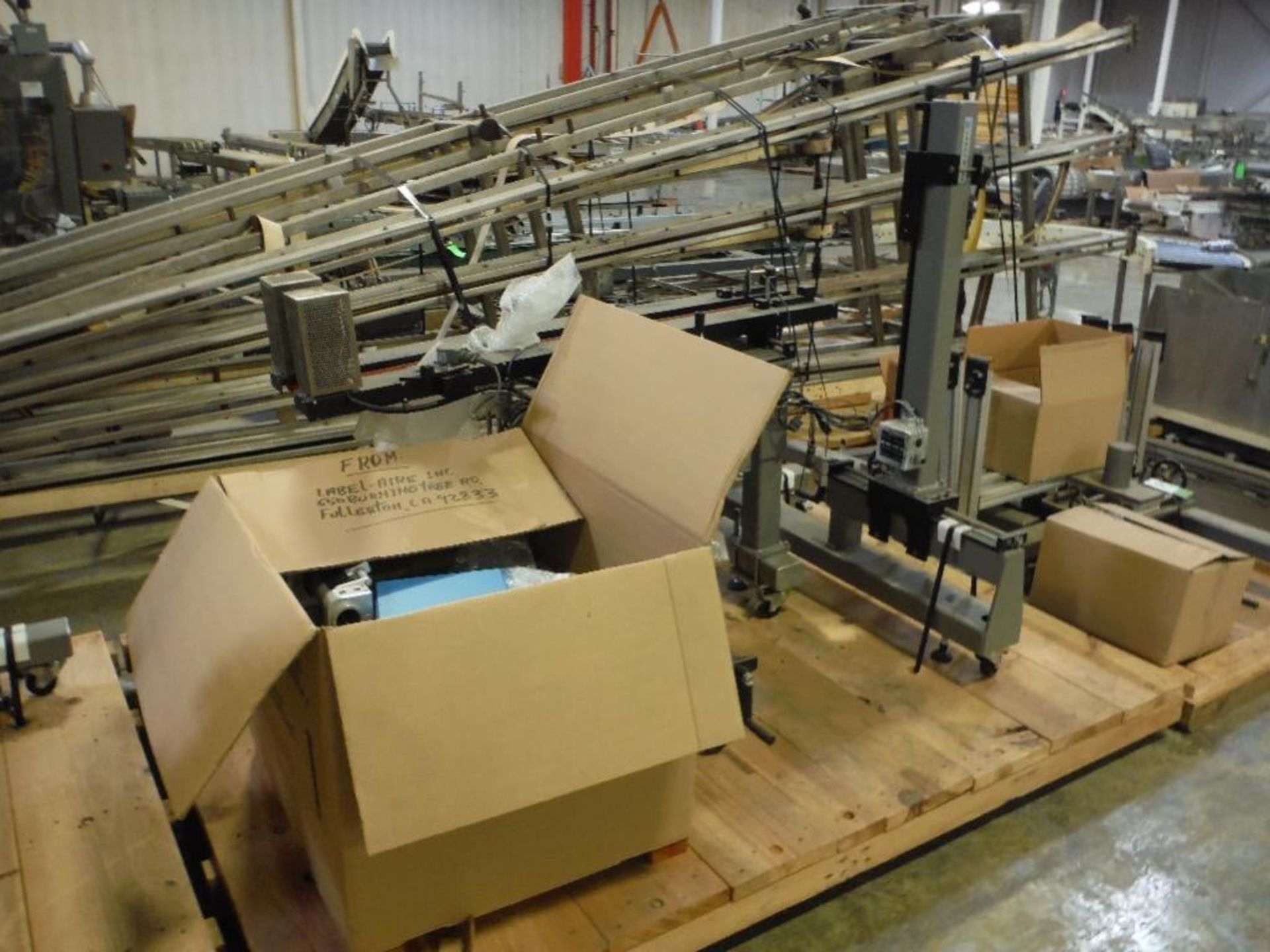 Unused Label-Aire labeler, Model 3115-CD, SN 023670, adjustable cart, hugger belt conveyor and contr