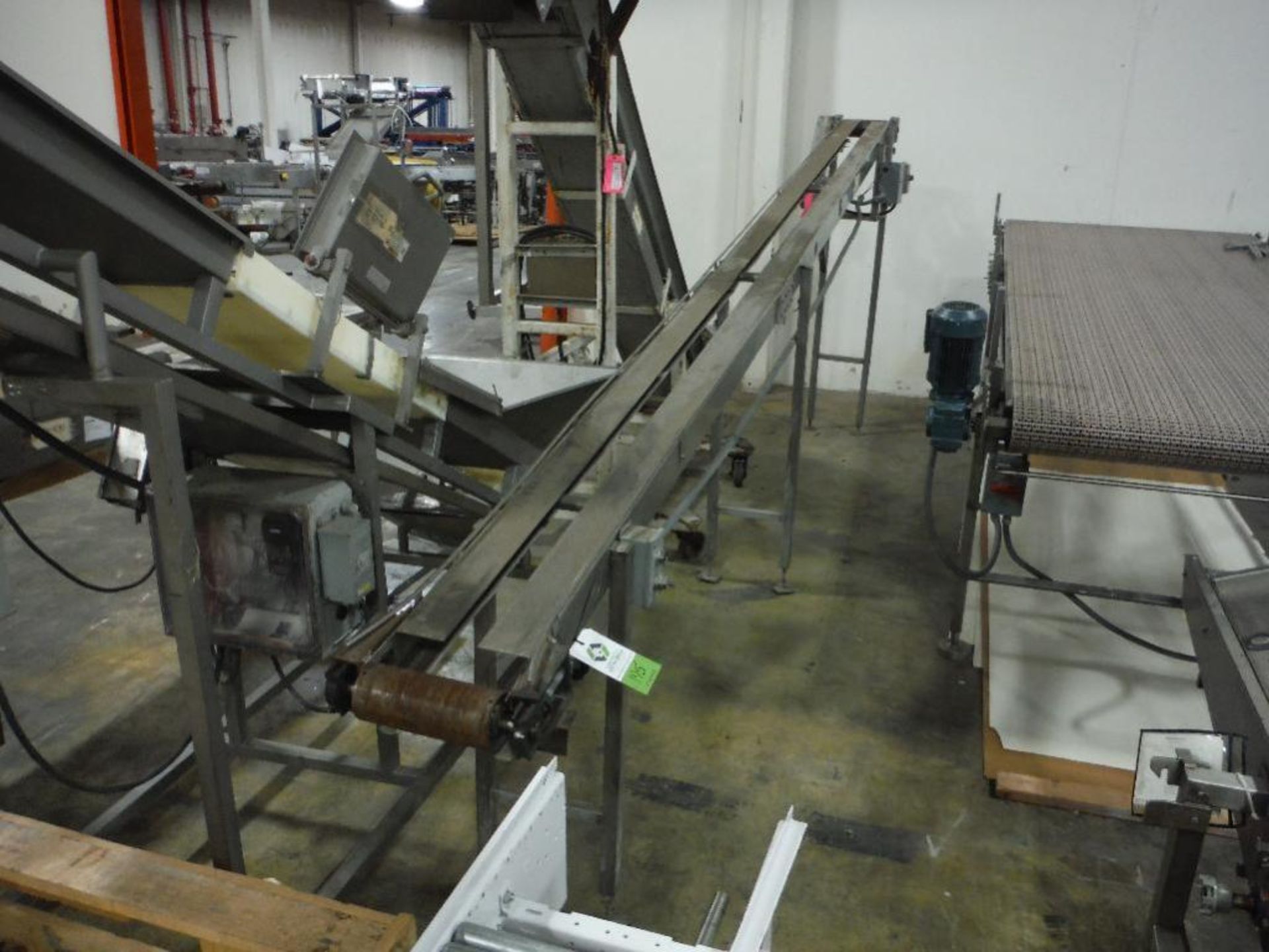 SS incline conveyor, 208 in. long x 10 in. wide x 34 in. infeed x 72 in. discharge, SS wash-down mot