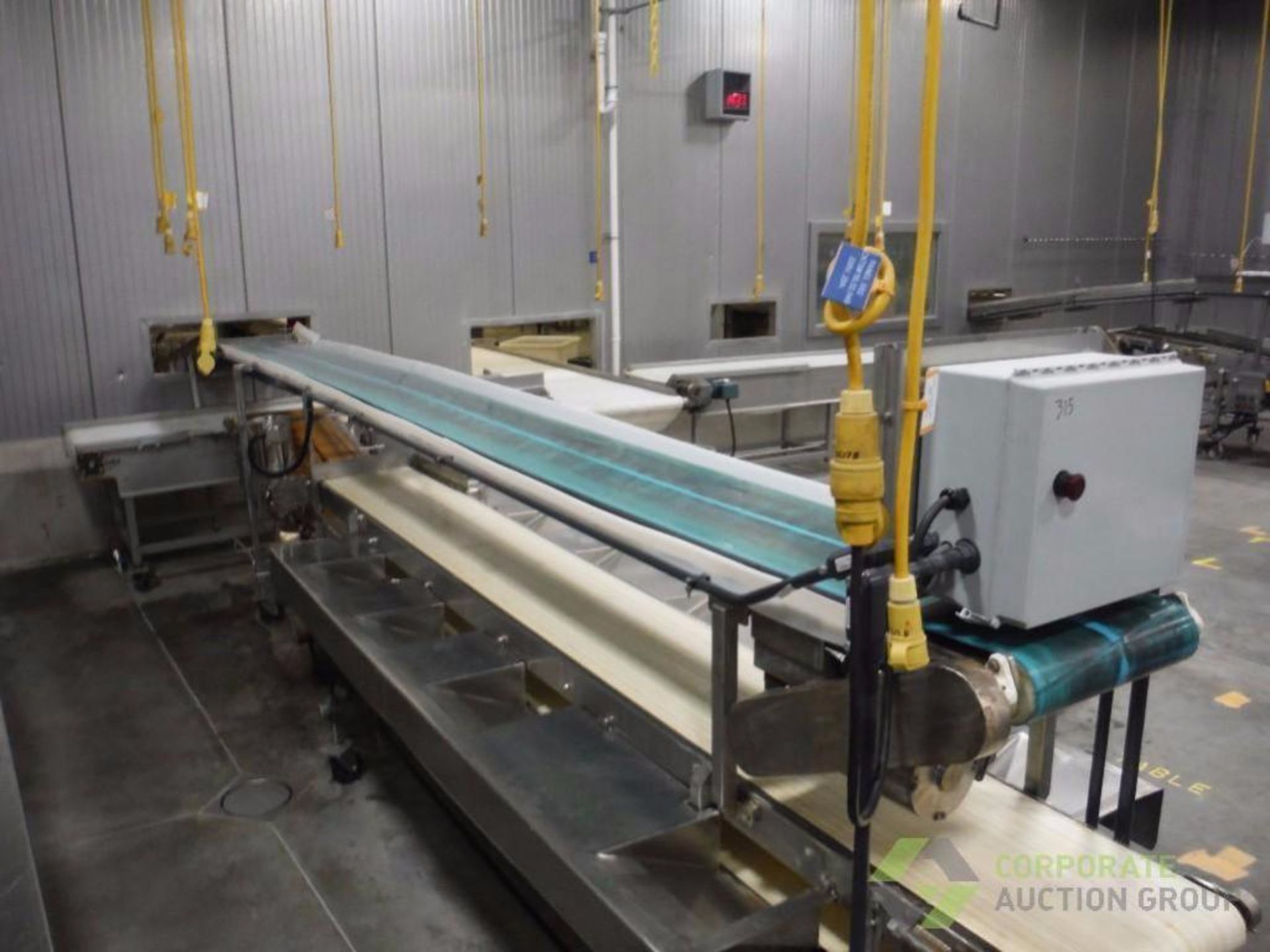 SS packoff conveyor, 21 ft. long, (4) conveyors, SS washdown motors, on wheels ** Rigging Fee: $ 100 - Image 2 of 9