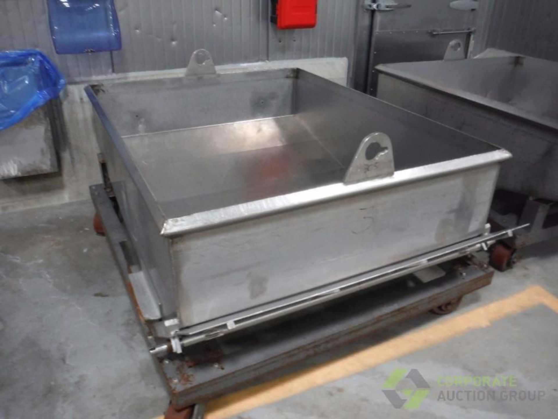 SS dough trough, 66 in. long x 52 in. wide, slant bottom with turn gate, mild steel frame on wheels