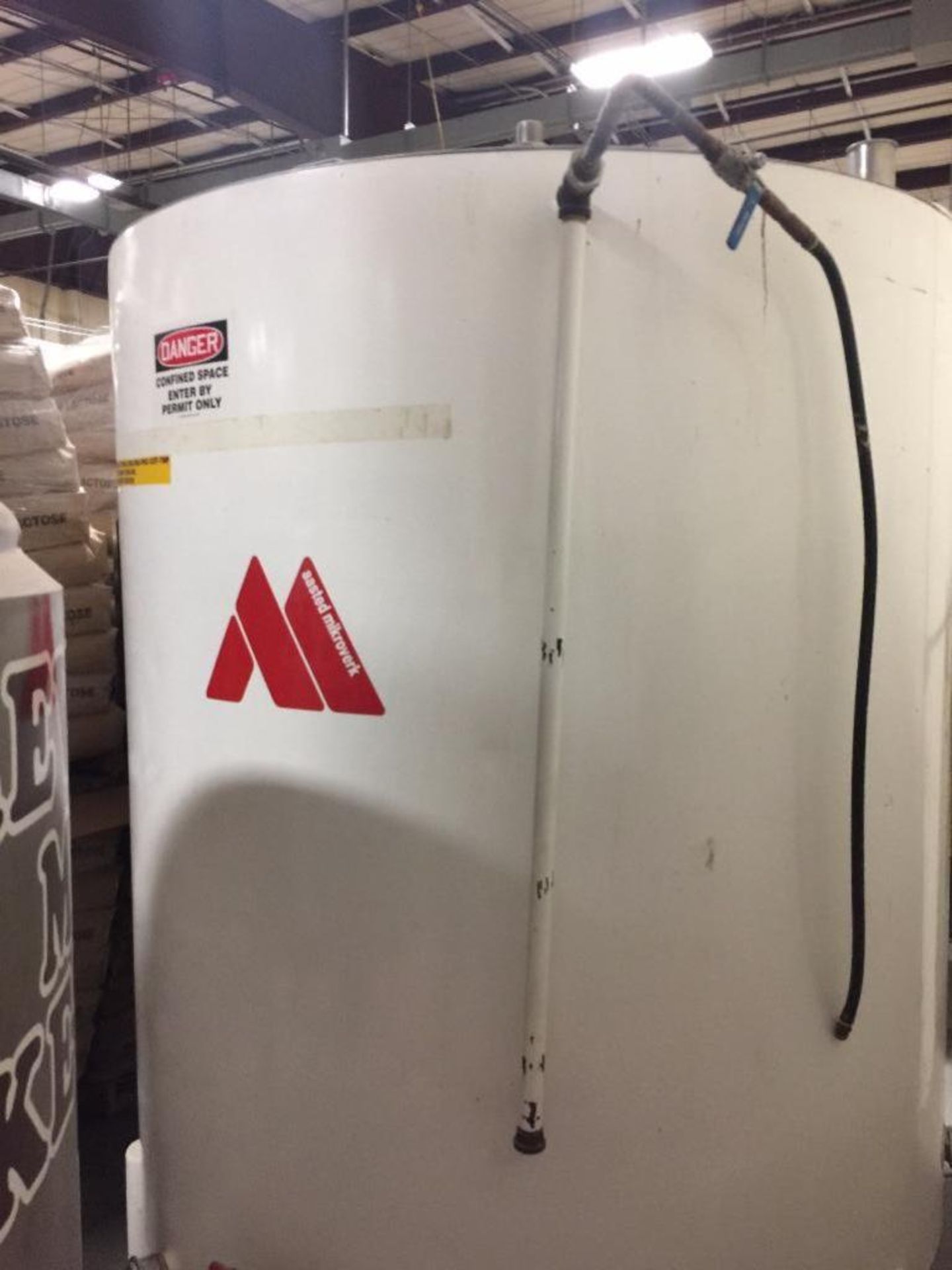 2,000 gal mild steel heated chocolate tank with controls, top mounted agitator ** Rigging Fee: $ 1,5