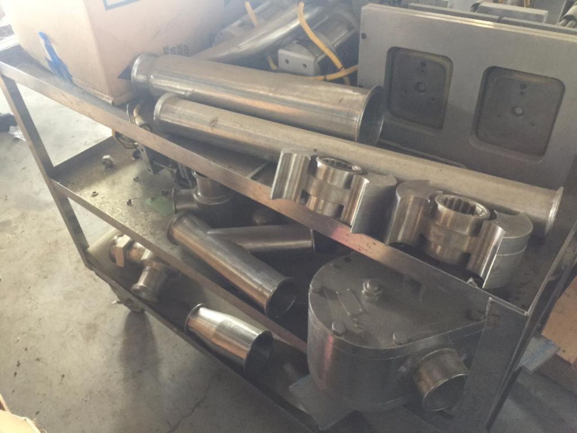 SS cart with assort pd pump parts and forming heads ** Rigging Fee: $ 175 ** (Located in: College Pa