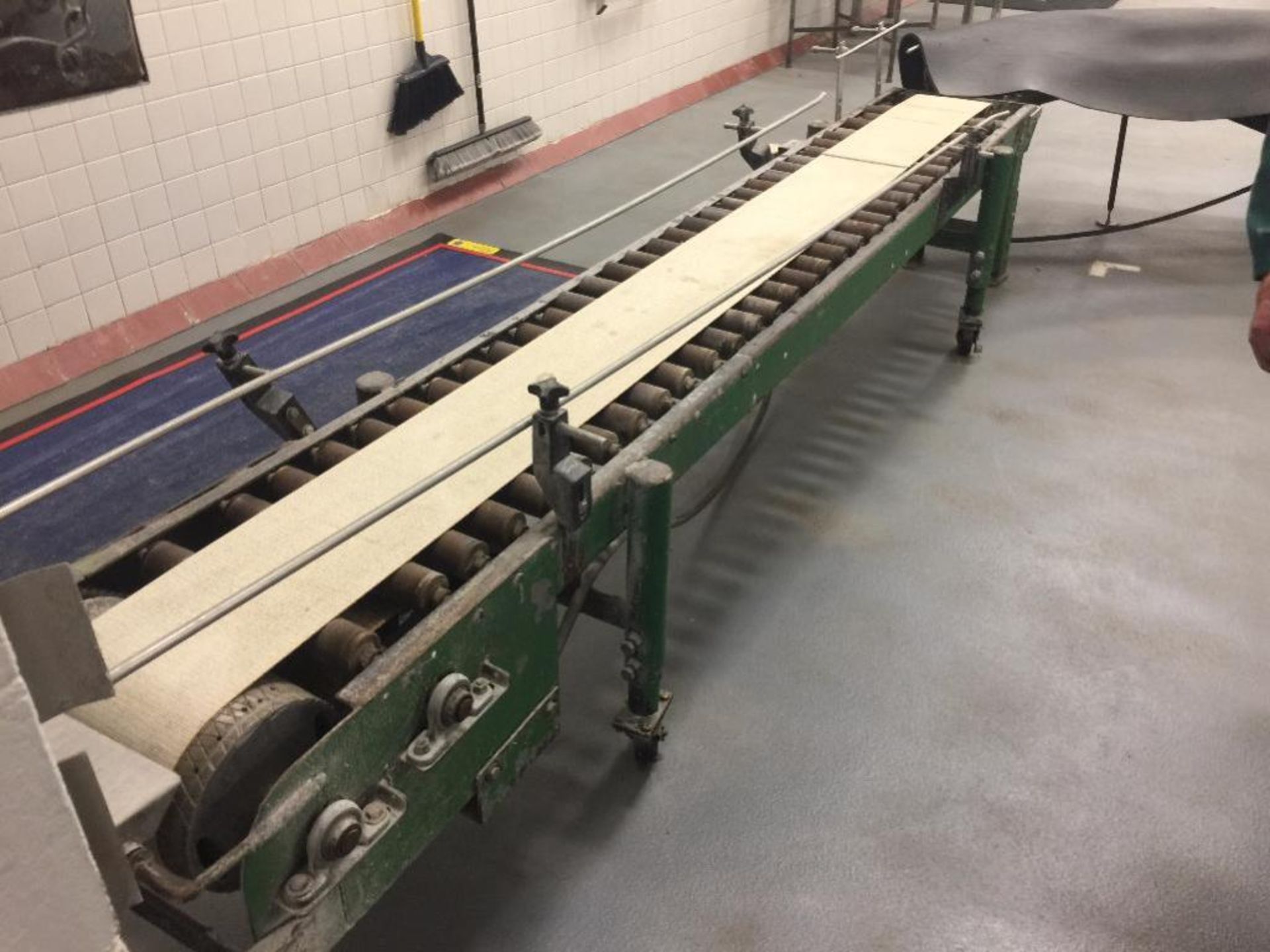 Power roller conveyor, 90 degree turn, 111 in. long x 9 in. belt, 14 in. roller, motor and drive. **