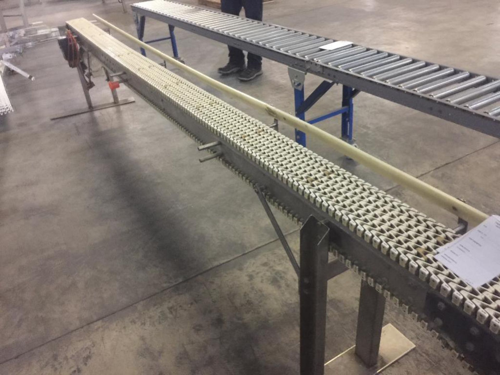 Spantech SS conveyor, 15 ft. x 6 in. x 29 in. tall, white plastic chain belt, motor and drive, on wh