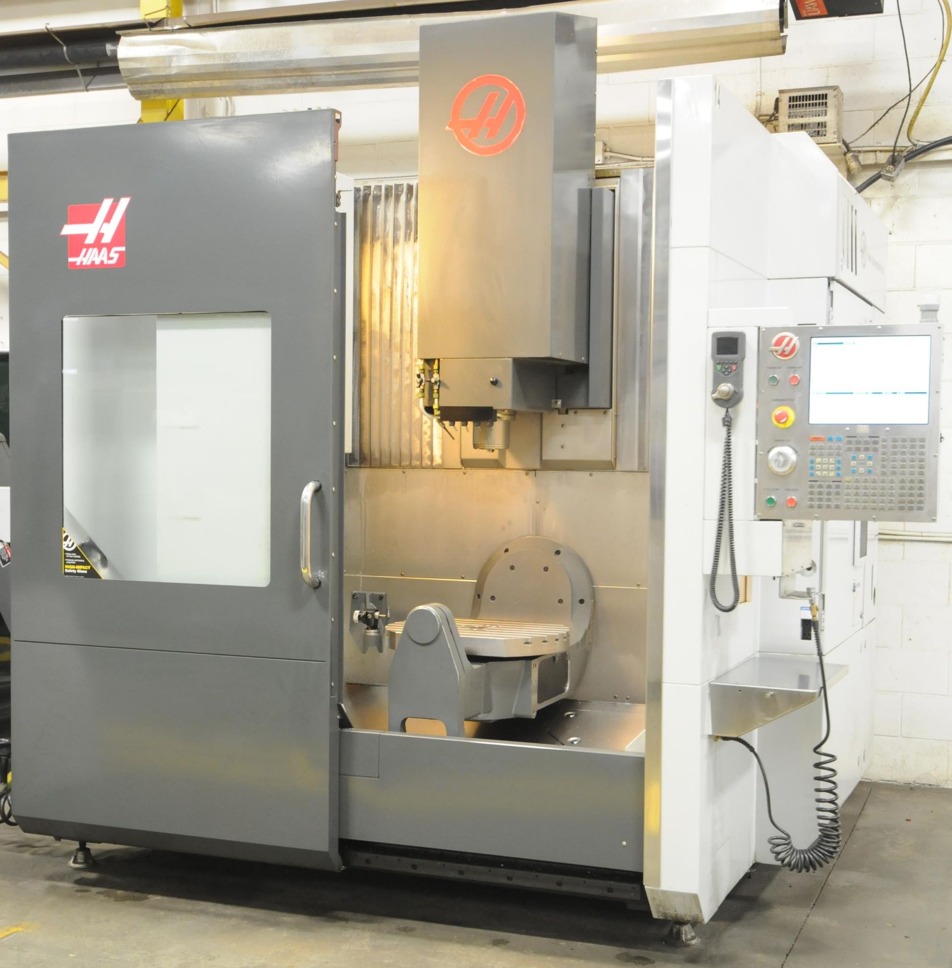 HAAS (2014) UMC-750 5-AXIS CNC VERTICAL MACHINING CENTER WITH HAAS CNC CONTROL, 19.7" DIAMETER