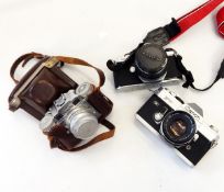 Quantity of cameras and lenses including a Pentax Asahi ME SLR camera, a Canon FTQL SLR camera,