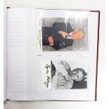 Album containing autographed photographs and postcards, some facsimile, predominantly politicians,
