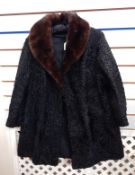 A black astrakhan coat with dark mink collar, Marshall & Snelgrove,