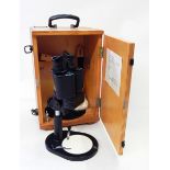 A Russian binocular microscope in case