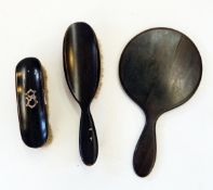 Ebony dressing table set, an iridescent glass paperweight in the form of an egg,