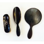 Ebony dressing table set, an iridescent glass paperweight in the form of an egg,