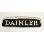 Daimler alloy radiator name plate, 39cm long and two other metal vehicle plates, one inscribed "CM",