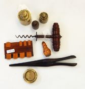 Victorian steel corkscrew with turned mahogany handle, a pair of glove stretchers,