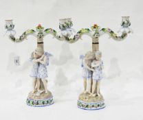 A pair of German porcelain two-branch figural candelabra by Ernst, Bohne & Sohne,