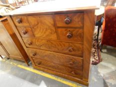 Victorian mahogany chest of four short and three long graduated drawers with bun handles,