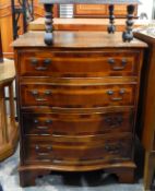 Reproduction serpentine fronted chest of four long drawers, on bracket feet,