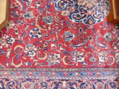 Iranian Saruq wool rug, the crimson ground with central floral medallion,