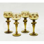 Set of nine German green glass roemers, the bowls decorated in gilt with vine leaves and grapes,