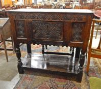 Antique carved oak cupboard on stand with floral carved panels, lunette frieze,